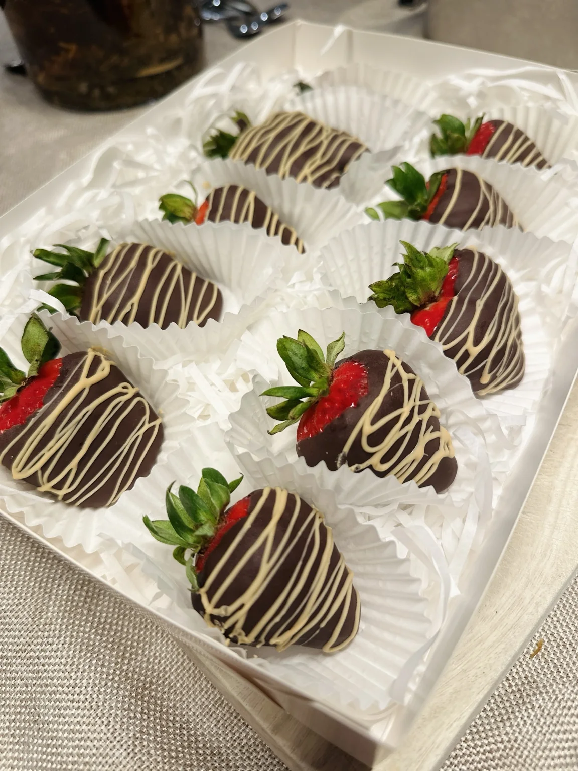 Chocolate-covered strawberries arranged in a gift tray