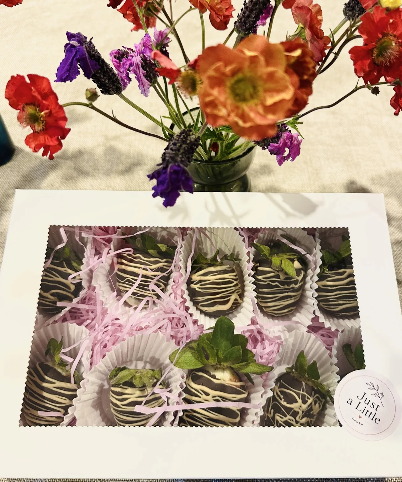 A strawberry gift box styled with flowers
